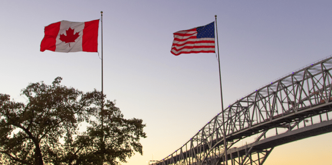 Canadian and United States flags at border